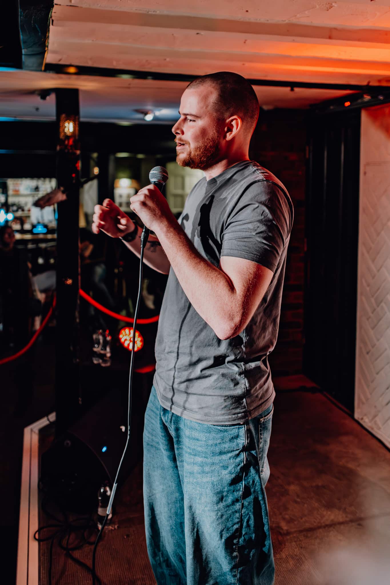 Stand-up comedian performing on the Oriels stage