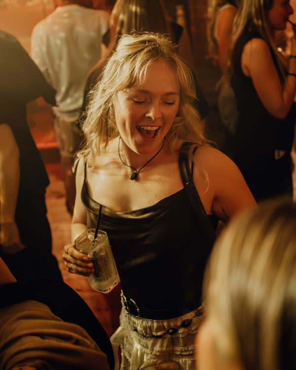 Guest laughing on the dance floor at Oriels Exeter