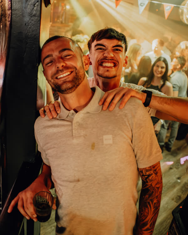 Friends smiling at Oriels Exeter
